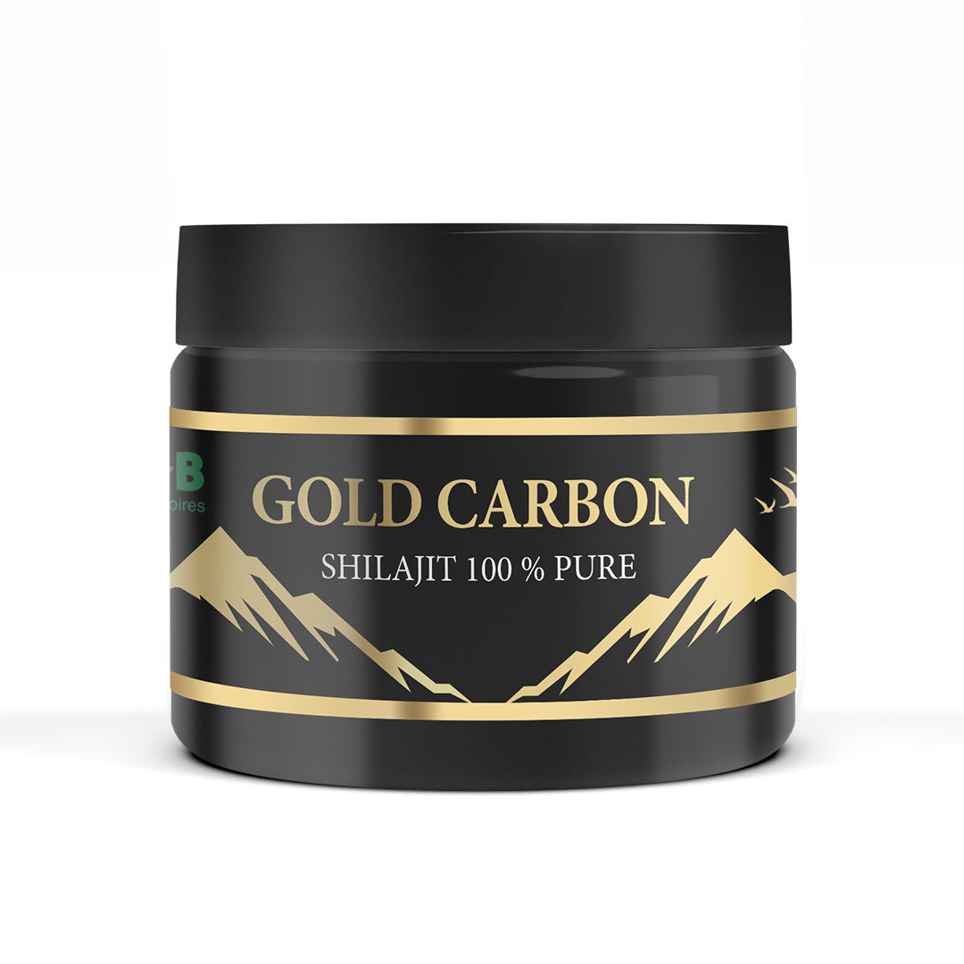 Poteau noir avec étiquette dorée "GOLD CARBON" et montagnes stylisées en or; texte "SHILAJIT 100 % PURE" sur le pot.